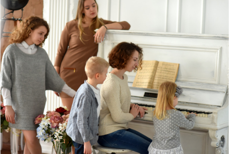 Large Family Learning To Play The Piano, Affordable Piano Lessons For Large Families