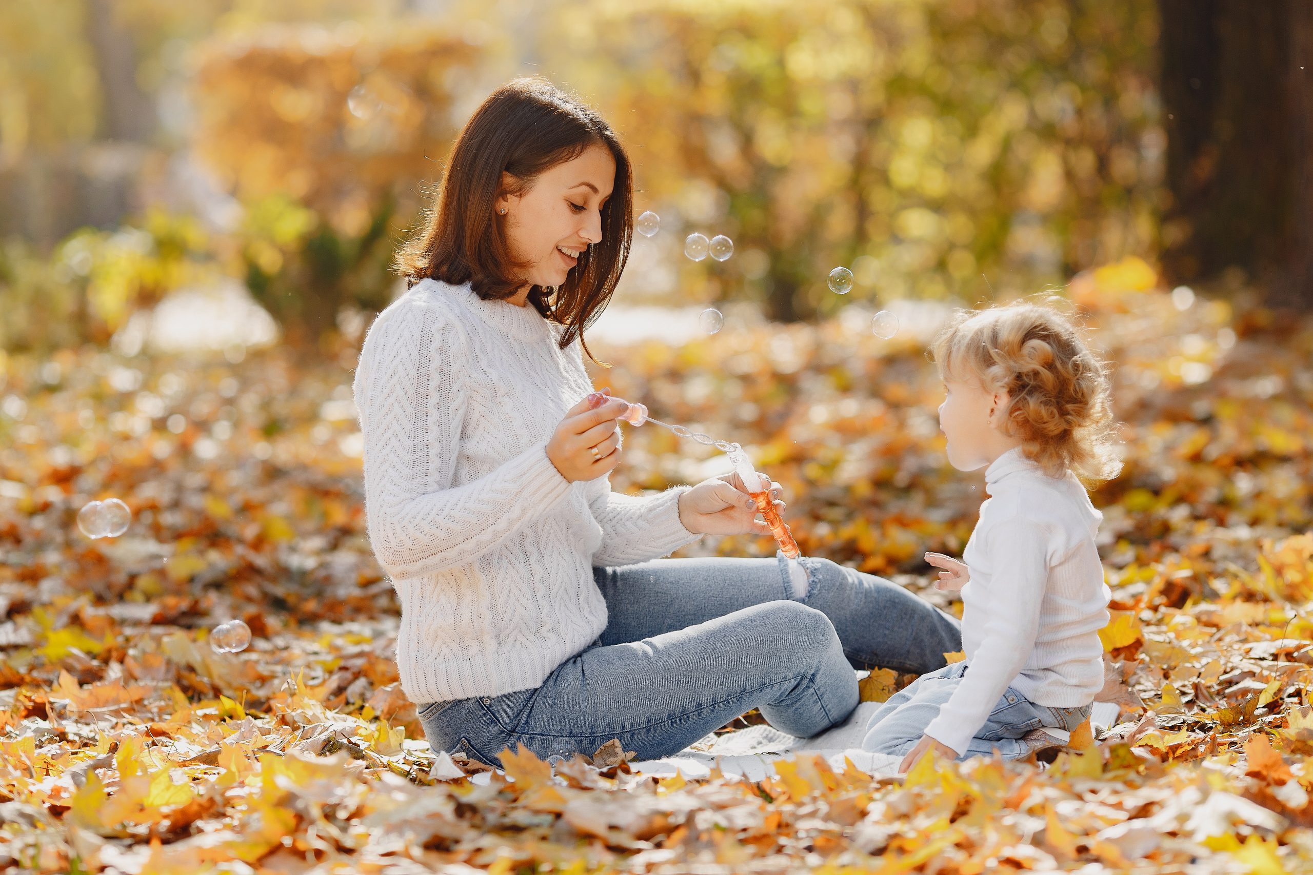 Mother And Daughter Playing Outdoors And Blowing Bubbles, You Can Incorporate Music Into All You Do (Indoors And Outdoors)